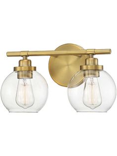 two light bathroom fixture with clear glass globes and gold metal fixtures on the wall