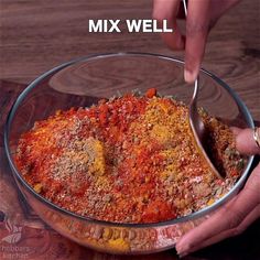 a person scooping food into a bowl with the words mix well above it and below