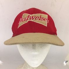 the budweiser hat is on top of a mannequin's head