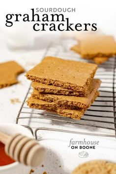 graham crackers stacked on top of each other in front of a bowl of sauce