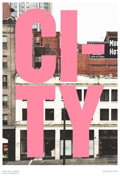 the word city written in pink on top of a building with tall buildings behind it