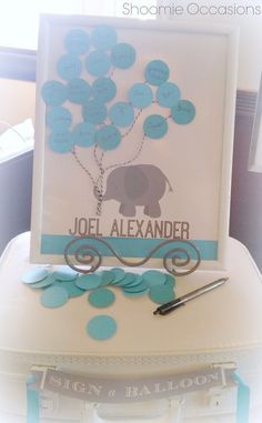 a card with an elephant on it and some blue balloons attached to the back of it