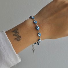 Get ready to have all eyes on you with our Nazar Bracelet! This stunning bracelet will make any outfit stand out. Complete the set with our Nazar Necklace and Nazar Anklet! Nazar Necklace, Nazar Bracelet, Hand References, Concert Hairstyles, Hairstyles Long, Waist Chain, All Eyes, Belly Rings, Blue Bracelet