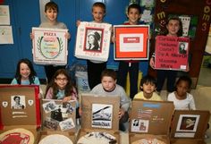 a group of children holding up pictures and pizza boxes in front of their school's lockers