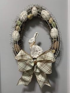 a wreath with a white rabbit on it