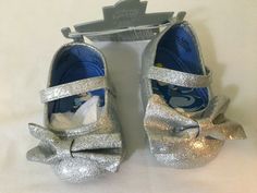 NWT Disney Store Cinderella Baby Costume Shoes Princess 0 6 M 6 12 18 Months. Disney Store exclusive. Smoke free and pet free home. Slip-on shoe with simulated leather uppers Silver glitter finish 3D bow appliqué  Simulated leather strap with self-stick fabric fastener Heel tab for easy on and off Non-slip soles Coordinates with our Cinderella Costume Bodysuit for Baby, sold separately The bare necessities All man-made materials Imported Costume Bodysuit, Shoes Princess, Cinderella Costume, Baby Costume, Costume Shoes, Bare Necessities, Baby Costumes, Disney Store, Silver Glitter