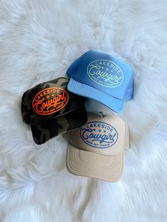 Customizable high crown, foam, mesh/adjustable backing trucker hat detailed with "Lakeside Cowgirl" design in a color of your choice! Hats shown in listing picture: (Top) Light blue hat, light teal design (Middle) All over camo hat, neon orange design (Bottom) Khaki hat, royal blue design One size fits most. Royal Blue Design, Cowgirl Design, Teal Design, Camo Hat, Camo Hats, Orange Design, Hat Ideas, Light Teal, Blue Hat