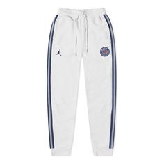 Men's Jordan x PSG Crossover Paris Saint-Germain Casual Running Training Stripe Sports Pants/Trousers/Joggers Gray DB6502-051 White Streetwear Bottoms With Logo Detail, White Bottoms With Logo Detail For Streetwear, White Logo Bottoms For Streetwear, Casual White Bottoms With Logo Detail, White Casual Bottoms With Logo Detail, White Jogging Bottoms With Three Stripes, White Jogging Bottoms With Three Stripes Branding, White Bottoms With Three Stripes For Jogging, White Sweatpants With Three Stripes For Sports