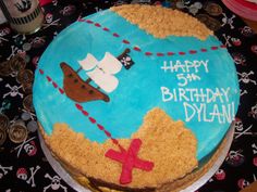 a birthday cake with a pirate ship on it