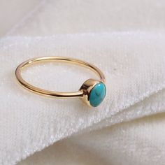 "Materials Gold, Rose gold, White gold Gemstone: turquoise Turquoise Ring / Round Cut Turquoise Ring In 14k Gold / Stackable Turquoise Ring / Natural Turquoise / December Birthstone Ring / Fine Ring Item Features * Made to Order. * Gold KT: 14K * Custom Gold Color: Rose Gold, Yellow Gold, White Gold * Gemstone Cut: Round * Number of Stones: 1 * Stone Size: 4 mm * Setting Type: Bezel * Band Width: 1.25mm * Ring is marked gold Marked * ready to Ship in 7-10 Business Days * Also available in other Gold Turquoise Ring With Gemstone, Gold Turquoise Ring Fine Jewelry, Gold Turquoise Ring Gift, Gold Turquoise Ring For Gift, Dainty Gold Turquoise Gemstone Ring, Dainty Gold Turquoise Ring, Turquoise Round Opal Ring In 14k Gold, Turquoise Opal Ring In 14k Gold, Turquoise 14k Gold Round Opal Ring