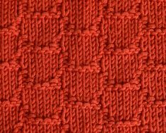 an orange knitted material with small squares on the top and bottom, in rows