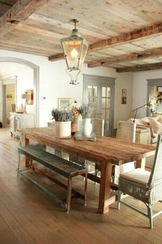 a wooden table sitting in the middle of a living room