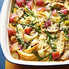 a casserole dish with potatoes, green beans and other veggies in it