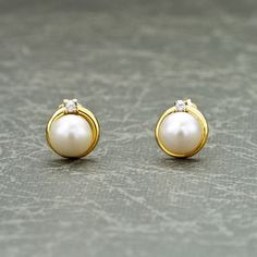 Freshwater Pearl Stud Earrings for Women *  Gold studs with  freshwater pearls and cubic zirconia stones  *  9mm by 8mm 9ct gold stud earrings for women with 6.5mm round freshwater pearls.  *  Elegant pearl stud earrings made from 9ct yellow gold *  Stylish pearl earrings for women. Quality gold jewellery for women by Anakao.  *  All our jewellery is presented in a specially designed jewellery box, creating a beautiful gift or keepsake Anakao - Quality gold pearl jewellery for women ◆ The simple Yellow Gold Cubic Zirconia Pearl Earrings For Anniversary, Gold Brilliant Cut Pearl Earrings For Anniversary, Anniversary Yellow Gold Pearl Earrings With Cubic Zirconia, Elegant Pearl Birthstone Earrings For Anniversary, Elegant Birthstone Pearl Earrings For Anniversary, Pearl Earrings Studs, 9ct Gold Earrings, Round Pearl Earrings, Pearl Earrings Designs