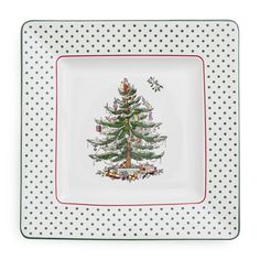 a christmas tree on a white plate with polka dots