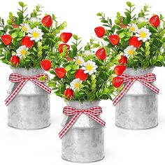 two tin cans filled with flowers and hearts