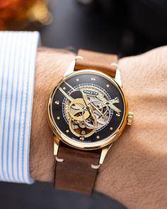 Our exclusive Raketa Skeleton watch is a stunning display of craftsmanship and attention to detail. It features an open skeleton design, revealing the intricate workings of the movement underneath.  The dial is adorned with gold-toned embellishments, including finely engraved patterns and gear wheels, creating a stunning visual contrast against the silver tones of the movement. The hour and minute hands are also gold-toned, adding to the overall elegance of the watch.  The watch is complemented by a stylish and durable leather strap, providing both comfort and a sophisticated look.  Year: 1980's  Case size: 39 mm  Case material: Steel, Brass  Strap material: Leather  Movement: Mechanical  FEEL FREE TO ASK ANY QUESTIONS ABOUT THE WATCH BEFORE PURCHASE! I will be happy to answer any question 1980's Men's Style, Watch Gift For Him, Gear Wheels, Skeleton Design, Skeleton Watches, Men's Vintage Watch, Retro Watches, Watch Gift, Authentic Watches