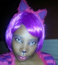 a woman with purple hair and cat ears