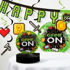 a game on party decorationating kit with balloons and streamers in the shape of video games