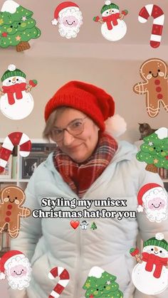 an older woman wearing a red hat and scarf with christmas stickers on the wall behind her