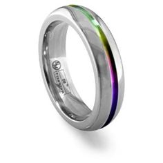 a wedding ring with rainbow inlays on the outside and inside, made from stainless steel