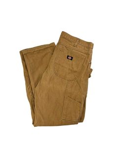 Vintage Dickies Canvas Workwear Carpenter Pants Size 37 MEASUREMENTS Size is based off measurements not the tagged size. Please refer to measurements. SIZE - 37 WAIST FLAT - 18.5" (measurement is multiplied by 2 to get the size) RISE - 12.5" INSEAM - 33" LEG OPENING - 9" Please note that due to the nature of pre-owned clothing; the size mentioned in the title may not be an accurate representation of the item's fit in accordance with modern sizing guides. Referring to the measurements will help t Brown Fitted Utility Pants, Utility Cotton Pants With Standard Cut, Relaxed Fit Work Pants With Belt Loops, Fitted Cotton Work Pants With Pockets, Workwear Pants With Pockets Standard Cut, Brown Work Pants With Hip Pockets, Utility Style Fitted Work Pants With Welt Pockets, Workwear Pants With Patch Pockets And Standard Cut Leg, Fitted Utility Work Pants With Welt Pockets