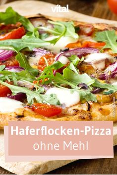 a close up of a pizza on a wooden surface with the words haferflocken - pizza ohne mehl