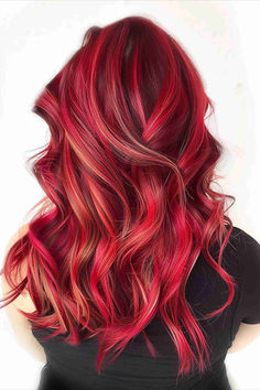 Cherry red hair with vibrant highlights, creating a playful and colorful look. Red And Gold Hair Color Highlights, Red Hair With Red Lowlights, Red And Blond Hair Ideas, Multi Red Hair Color Combos, Multi Red Hair, Purple And Auburn Hair, Copper And Magenta Hair, Cherry Red With Blonde Highlights, Red Dimensional Hair