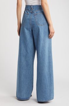 Tucked pleats structure the raw, cutoff waistband of these full-length, wide-leg jeans crafted from nonstretch organic-cotton denim in a light-blue wash. 33 1/2" inseam; 25" leg opening; 13 1/2" front rise; 16" back rise (size 29) Zip fly with hook-and-bar closure Five-pocket style 100% organic cotton Machine wash, tumble dry Made in the USA of imported fabric Light Wash Cotton Cropped Wide Leg Pants, Light Wash Cotton Wide Leg Cropped Pants, Light Wash Cropped Leg Wide Leg Cotton Pants, Light Wash Cropped Wide Leg Cotton Pants, Spring Wide Leg Rigid Denim Jeans, Light Wash Full-length Wide Leg Cotton Pants, High Rise Light Wash Cotton Wide Leg Pants, High Rise Light Wash Wide Leg Cotton Pants, Modern Light Wash Flare Jeans For Spring