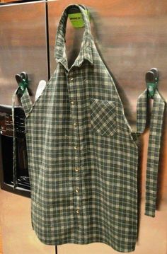 a green and white checkered shirt hanging on a refrigerator