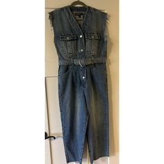 Upgrade Your Wardrobe With This Stunning Blank Nyc Sleeveless Cropped Denim Jumpsuit. This Jumpsuit Comes In A Beautiful Blue Denim And Has A Puff Sleeve Type With A Belted Waist, Making It Perfect For Any Occasion. The Jumpsuit Is Made From High-Quality Denim Fabric And Has Exquisite Features Such As Crop Design, Fringe, And Pockets. The Jumpsuit Is Available In Size Small Making It Perfect For Women Who Want To Look Chic And Elegant. This One-Piece Outfit Is Suitable For Everyday Wear, And It' White Denim Romper, Crop Design, Jumpsuit With Belt, Chic And Elegant, Short Sleeve Romper, Denim Romper, One Piece Outfit, Sleeveless Rompers, Blank Nyc