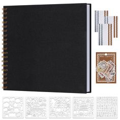 a black notebook with stamps and dies next to it