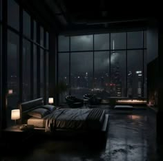 a bed sitting in a bedroom next to a window with city lights shining on it