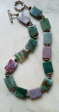 Green Moss Agate Jewelry With Natural Stones, Bohemian Green Rectangular Necklace, Earthy Green Gemstone Necklace, Earthy Green Agate Jewelry, Green Jasper Jewelry With Natural Stones, Green Rectangular Artisan Jewelry, Artisan Green Rectangular Jewelry, Green Jasper Jewelry With Gemstone Beads, Artisan Rectangular Green Jewelry