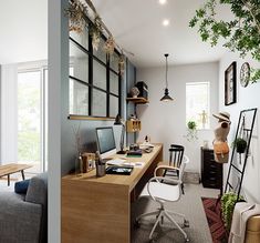 a home office with lots of plants and furniture in the corner, along with an open window