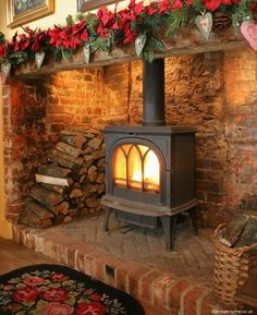 a fire place in a living room decorated for christmas