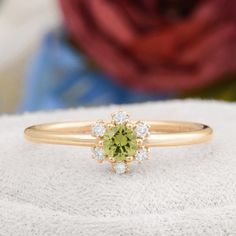 Description : Round Shaped Green Peridot Engagement 14K Solid Gold Ring, Certificated Genuine Peridot Diamond Wedding Ring, Peridot Birthstone Rings Diamond : 0.07 CT. F / SI (6 piece) Natural Green Peridot : 0.16 CT. (1 piece) Gram 1.33 (It may differ depending on the ring size) Product Code: MR0011859 This product belongs to Tilya Jewelery private collection . You can browse our store for other special collection products. All of our products are stamped and made of solid gold . All of our pro Peridot And Diamond Rings, Fine Jewelry Peridot Diamond Wedding Ring, Fine Jewelry Peridot Diamond Ring For Wedding, Lime Green Gemstone Wedding Rings, Lime Green Gemstone Rings For Wedding, Green Diamond Cluster Ring With Birthstone, Green Cluster Ring With Halo, Lime Green Wedding Rings With Accent Stones, Lime Green Wedding Rings