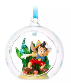 a glass ornament with a cartoon character inside