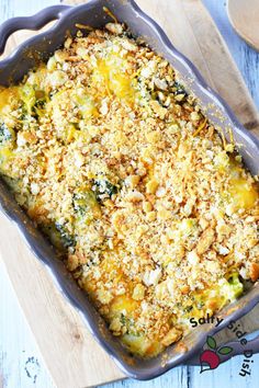 a casserole dish with broccoli, cheese and bread crumbs