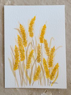 a painting of yellow flowers on white paper