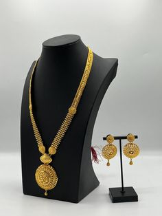 Embrace regal elegance with our exquisite 24K gold-plated Rani Haar set, a true masterpiece designed for the modern queen. This luxurious jewelry set, inspired by traditional royal designs, is perfect for weddings, special occasions, or adding a touch of grandeur to your collection. Care Instructions: To maintain the pristine condition of your Rani Haar set, avoid direct contact with water, perfumes, and harsh chemicals. Store in a dry, cool place when not in use. Elegant Gold Sets For Festive Season, Elegant Gold Sets For Festive Occasions, Traditional Gold Kundan Necklace With Elegant Design, Elegant Gold Plated Kundan Necklace For Ceremonial Occasions, Ceremonial Gold Kundan Necklace, Luxury Gold Bridal Necklace, Hallmarked, Luxury Gold Hallmarked Bridal Necklace, Luxury Hallmarked Gold Bridal Necklace, Elegant Meenakari Gold Plated Jewelry Sets