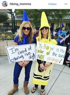 two women dressed in costumes holding signs that read i'm tired of the color of the sun orange