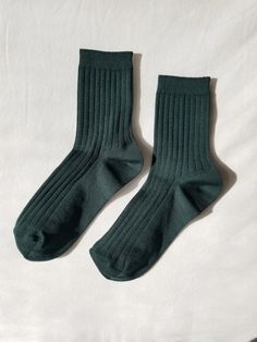 This classic pair of socks pairs well with any shoe, sandals, sneakers, mules, clogs, or boots. They are classically ribbed, the perfect height, and made a with breathable cotton blend in a wide assortment of colors. Product Details: Materials: 80% Cotton 18% Polyester 2% Spandex Sizing: One size fits most (US women's size 6-10) Care instructions: machine wash cold, tumble dry low, do not iron, do not bleach Shoe Sandals, Glitter Socks, Natural Textiles, Peacock Green, Colorful Socks, Cotton Socks, Slow Fashion, Soft Knits, Combed Cotton