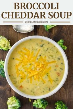 a bowl of broccoli cheese soup on a wooden table