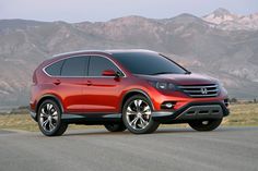 the new honda cr - v is shown in front of mountains