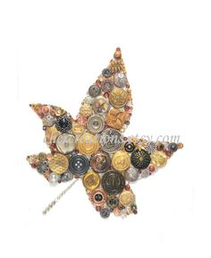 a star shaped brooch with lots of different buttons on it's back side