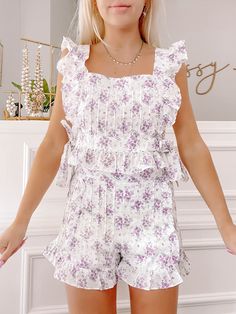 Meet the Linen Lilac Set from Sassy Shortcake. This playful short set features a lilac floral print and delicate ruffles, all tied together with side bow ties. Sassy Shortcake, Pinterest Closet, Short Set, White Tank, Striped Tee, Bow Ties, Short Sets, Ruffles, Lilac