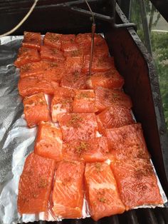 the salmon is being cooked on the grill