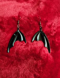 Gorgeous black bat wing earrings 🖤 These beauts are large black wings measuring 50mm x 35mm (5cmx3.5cm) 🖤 Hanging on Gunmetal black lead and nickel free earring hooks 🖤 Absolutely stunning  🦇statement earrings 🦇 will definitely stand out 🖤 Handmade Black Gothic Earrings, Handmade Black Vampire Earrings, Black Gothic Pierced Earrings, Batwing Earrings, Dagger Earrings, Funny Earrings, Earrings Gothic, Rave Clothes, Goth Earrings