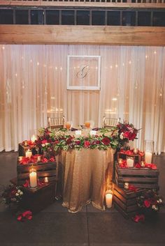 a table with candles and flowers on it